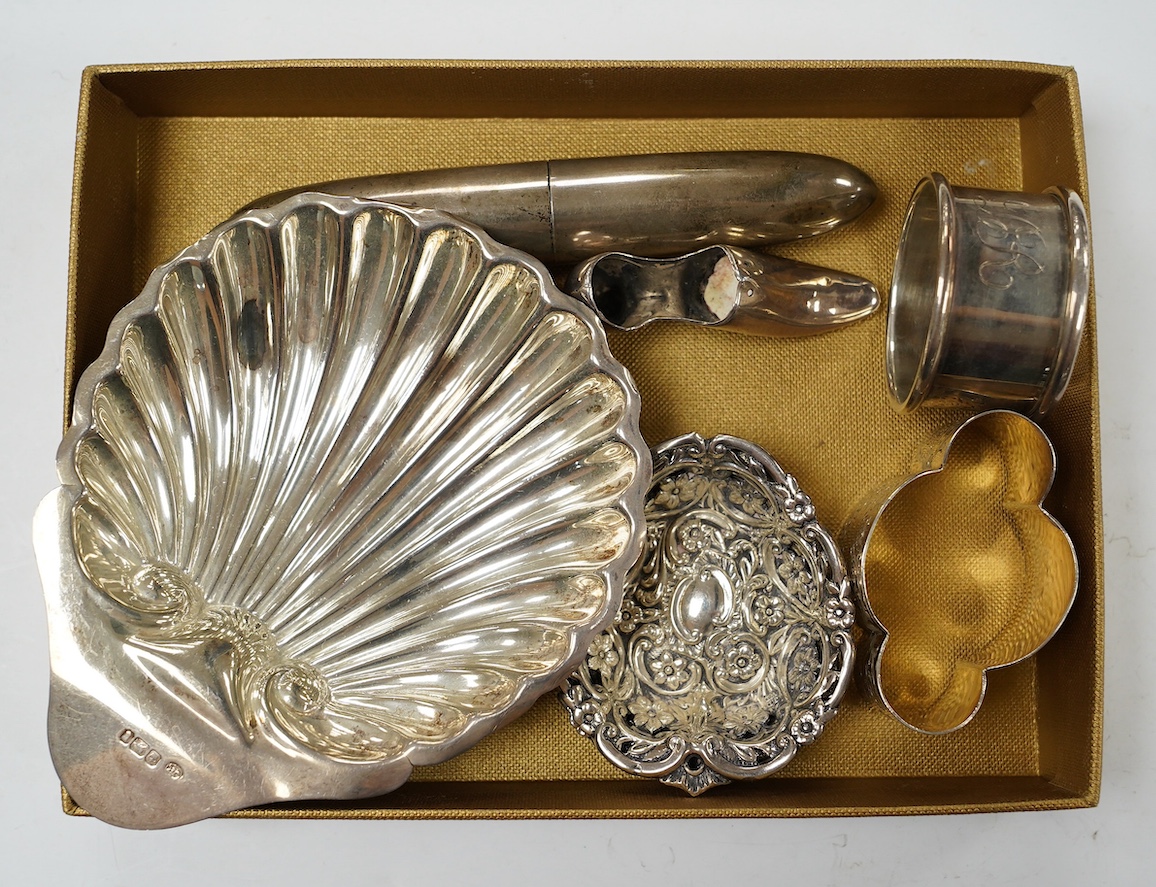 Sundry small silver, including a butter shell, napkin ring, pair of bon-bon dishes, shoe pin cushion and a late Victorian torpedo shaped single cigar case, Birmingham, 1900, 12.9cm. Condition - fair to good